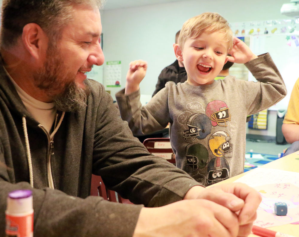 Bearcub Preschool students make Love Bugs with dad